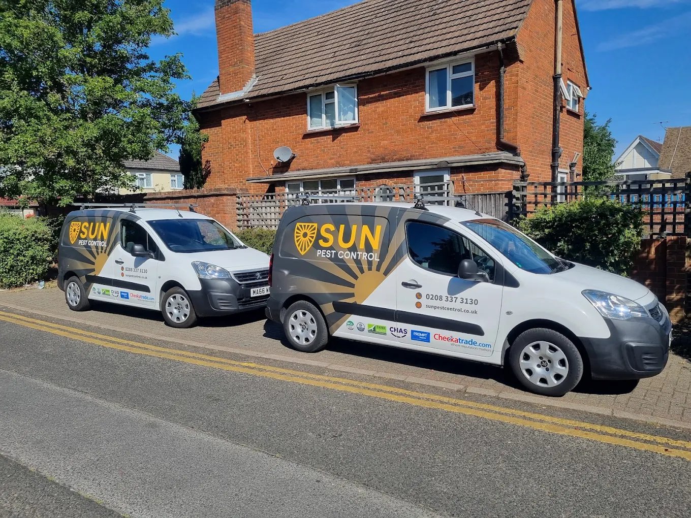 Sun Pest Control Ltd service vans parked on a residential street in Worcester Park.